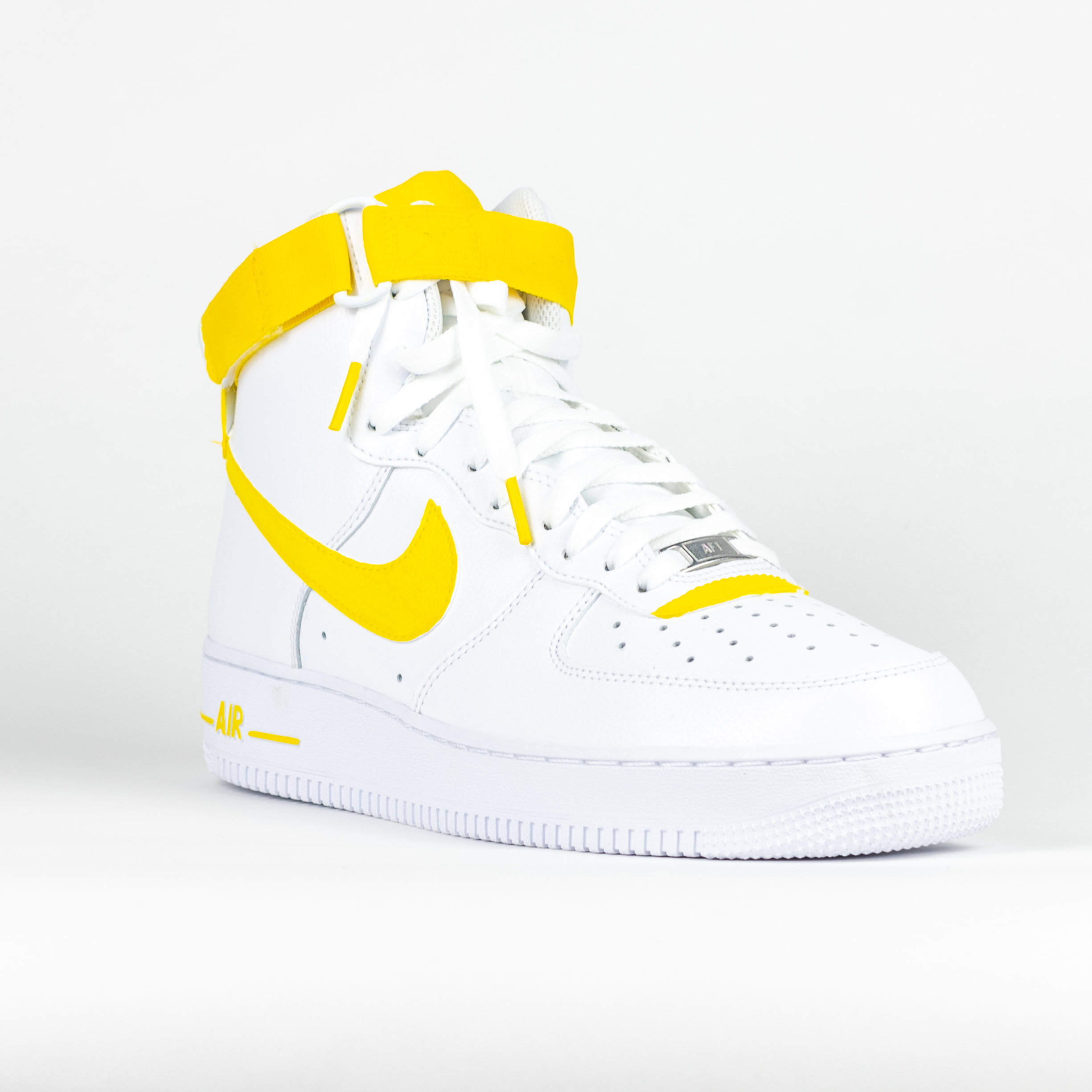 white and yellow high top air force ones