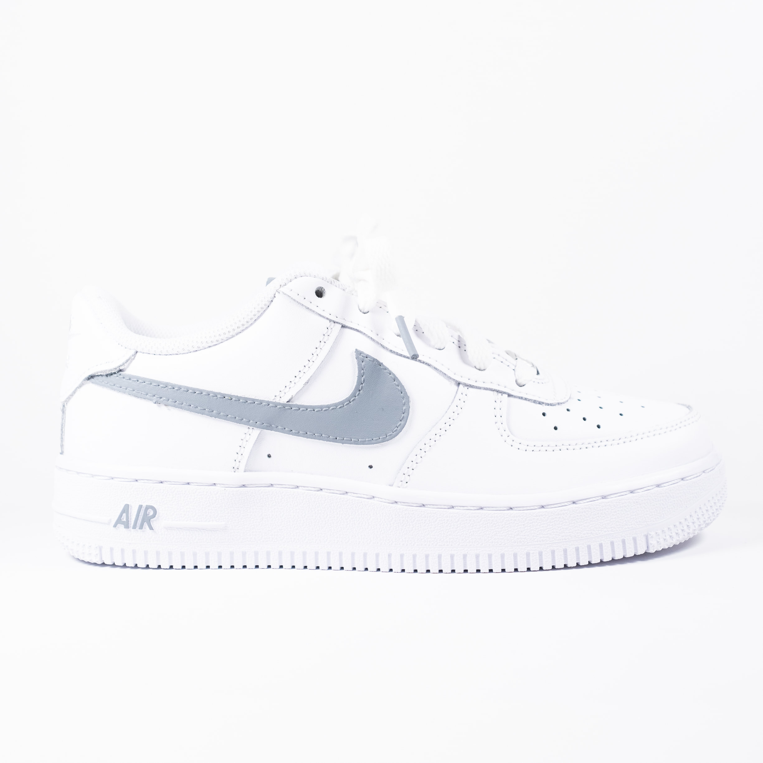 Nike Air Force 1 Worldwide sneakers in gray with black swoosh